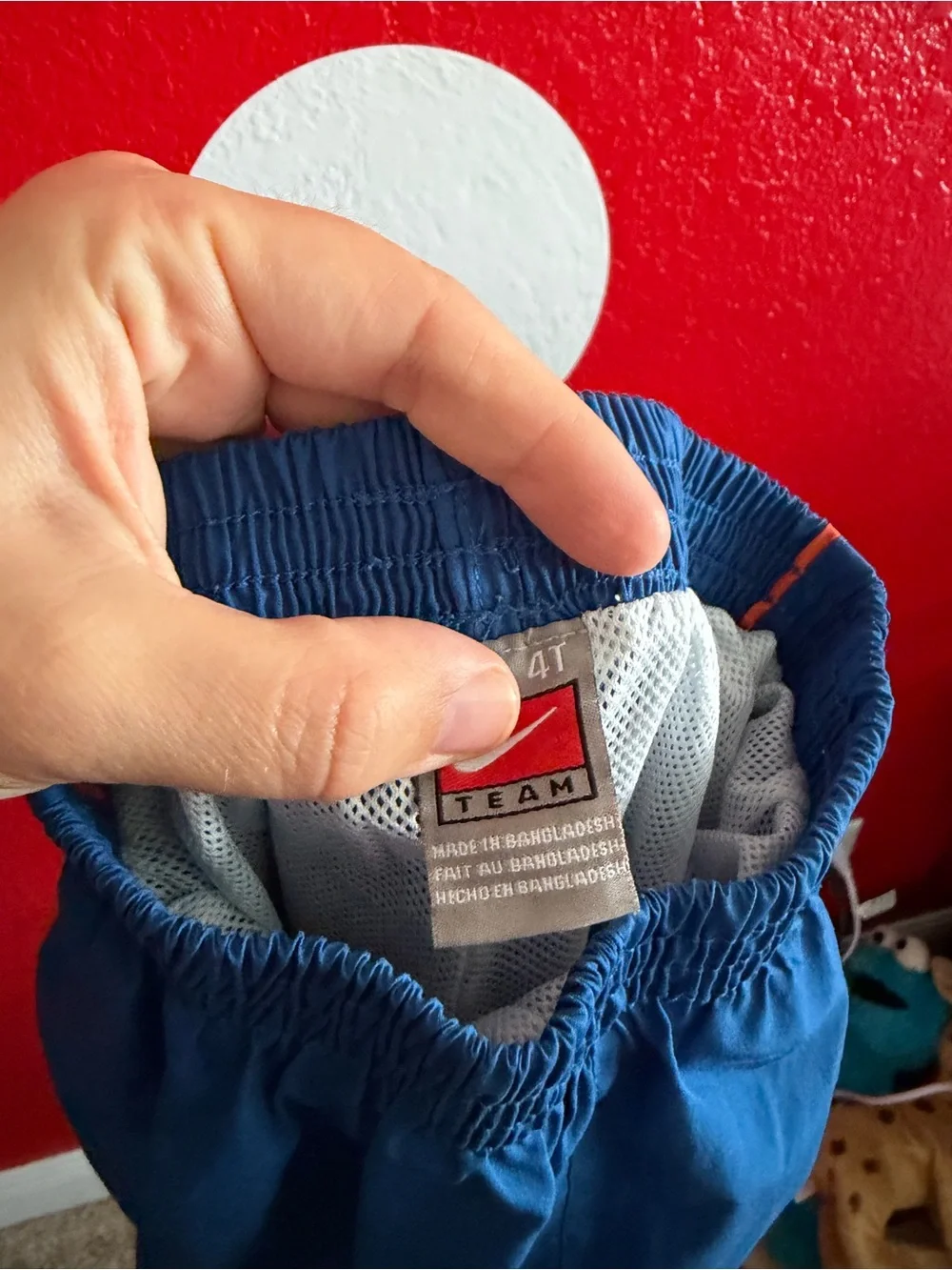 Vintage Nike Kids Blue Track Pants with Orange Trim